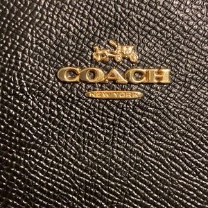 Coach black wristlet/wallet in crossgrain leather EUC gold emblem & zip closure